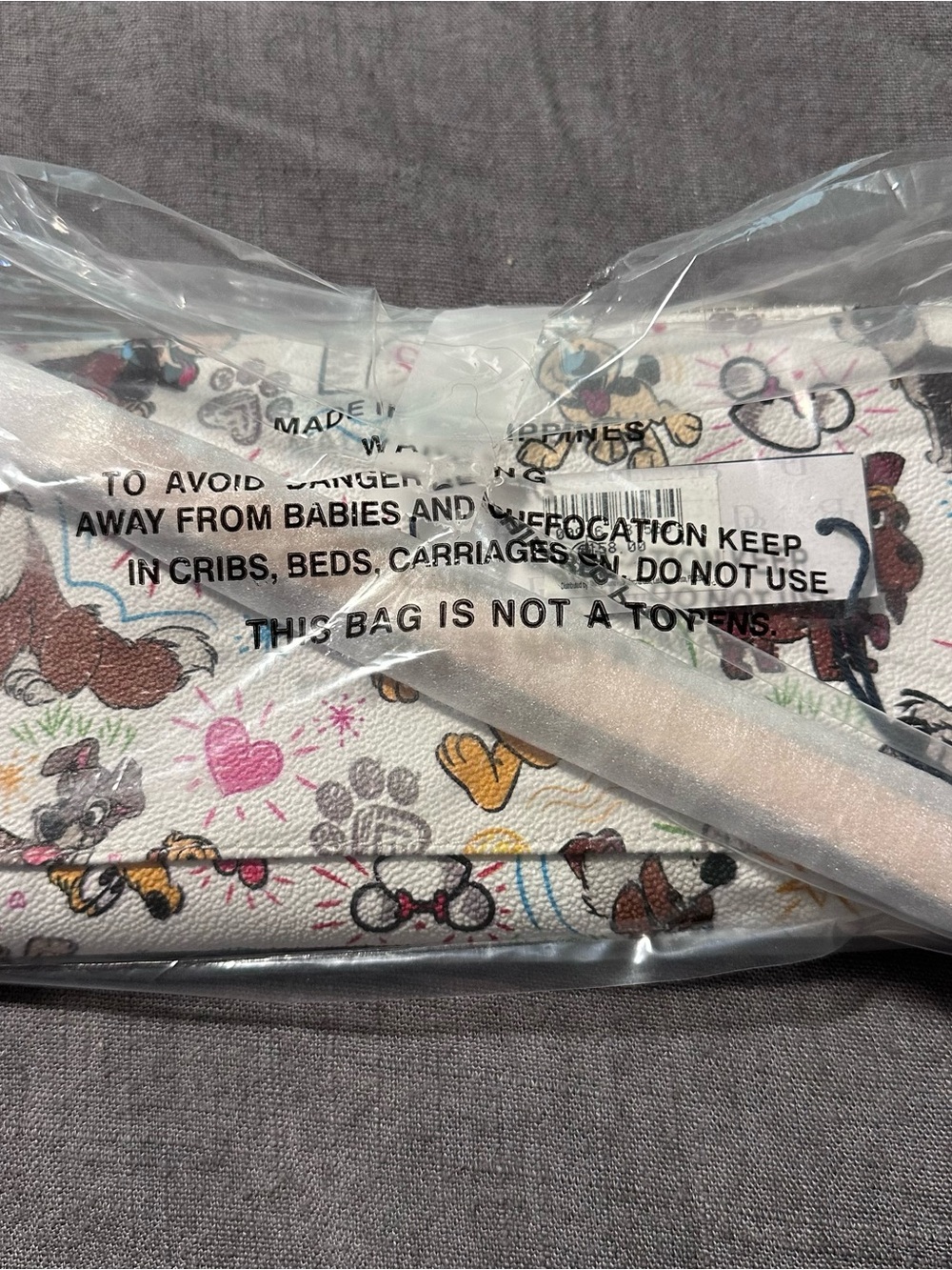 Dooney & Bourke White Disney Character Dogs Sketch Wristlet
